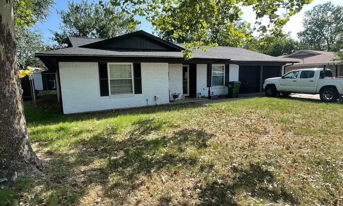 Professional roofing crew working on a residential roof in Dayton
